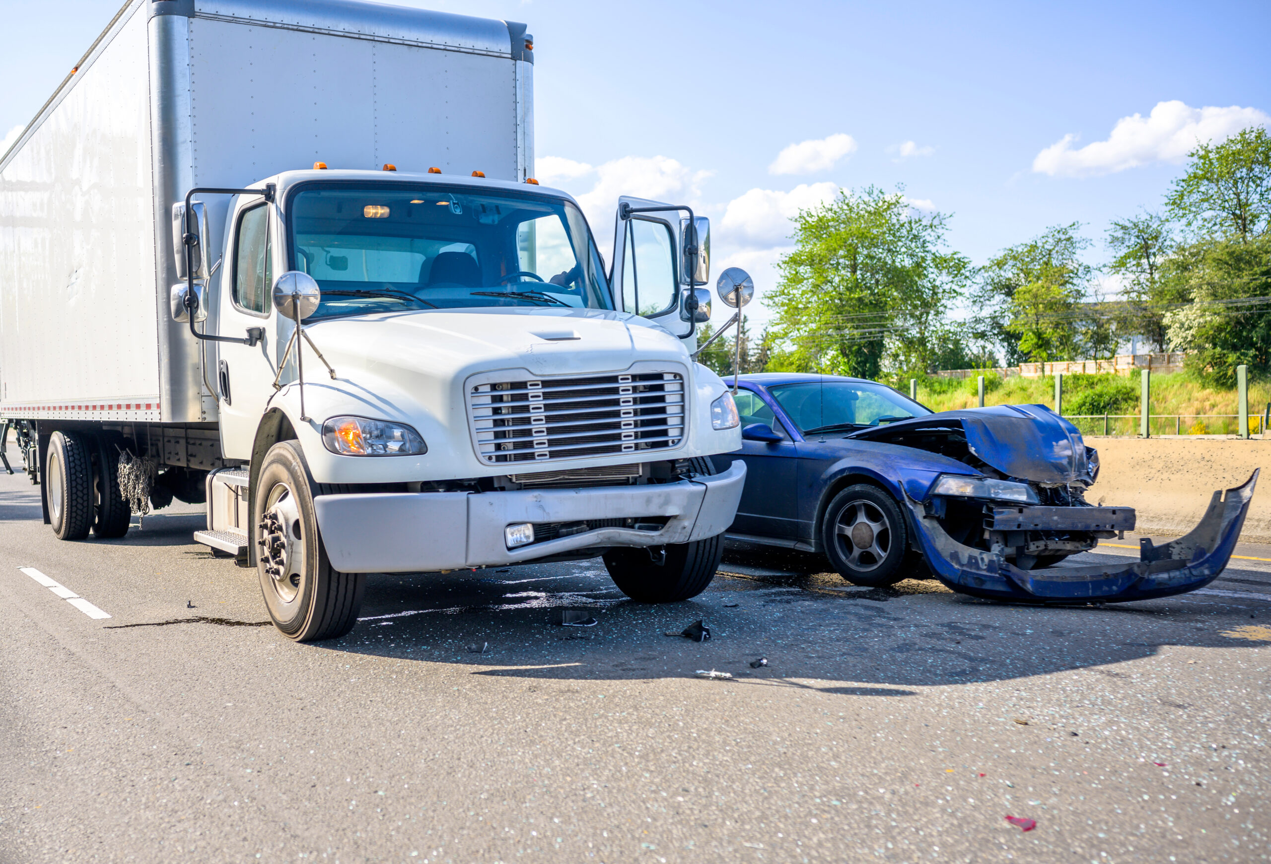 aftermath of a California commercial truck accident colliding into a smaller passenger vehicle